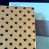 Rouleau / Bobine papier doré mat étoiles Noir 70cm Europe
